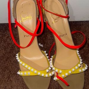 Yellow with white spikes and pink straps Louboutin heels.